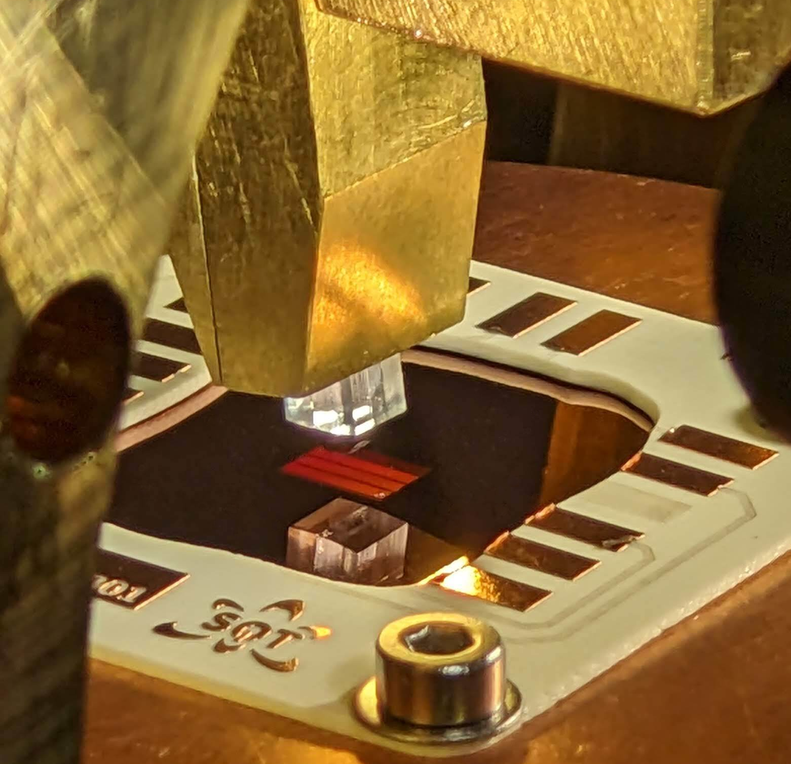 The T Centre Tango: Understanding how laser light couples to both the T centre and its environment